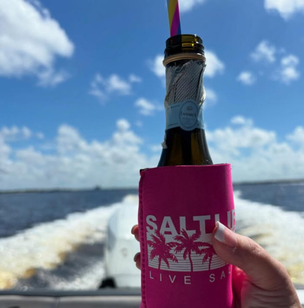A photo of a champagne bottle with a straw