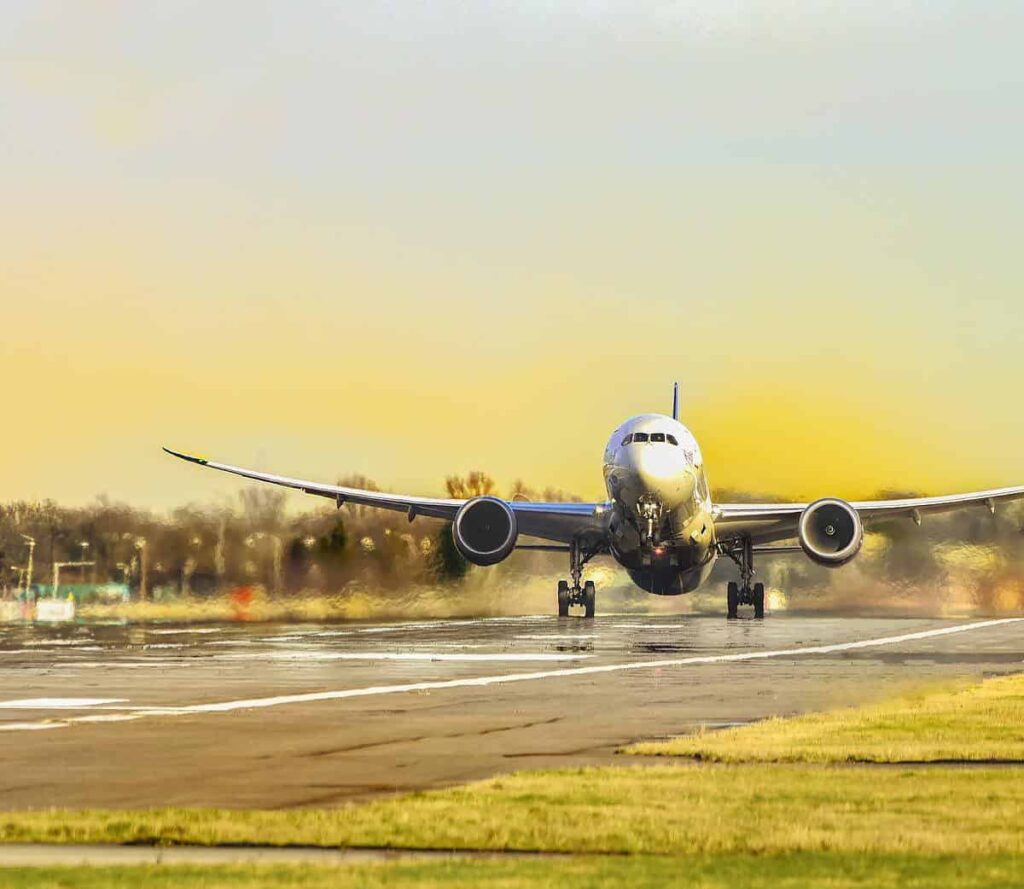 a photo of a plane taking off a runway