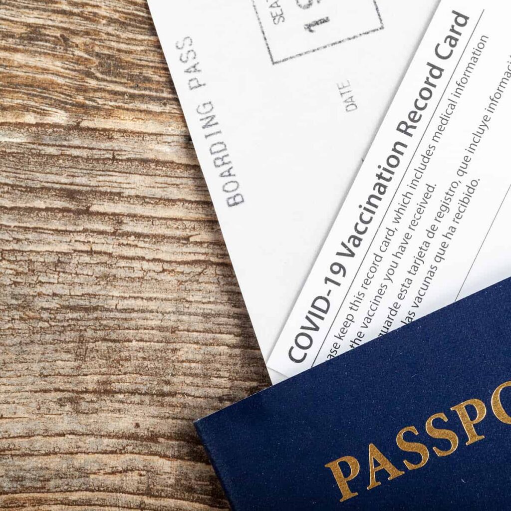 a photo of a passport and covid card