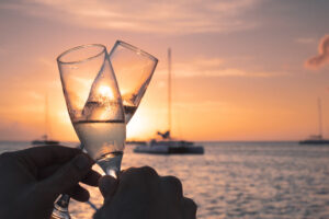 A photo of two people toasting with champagne