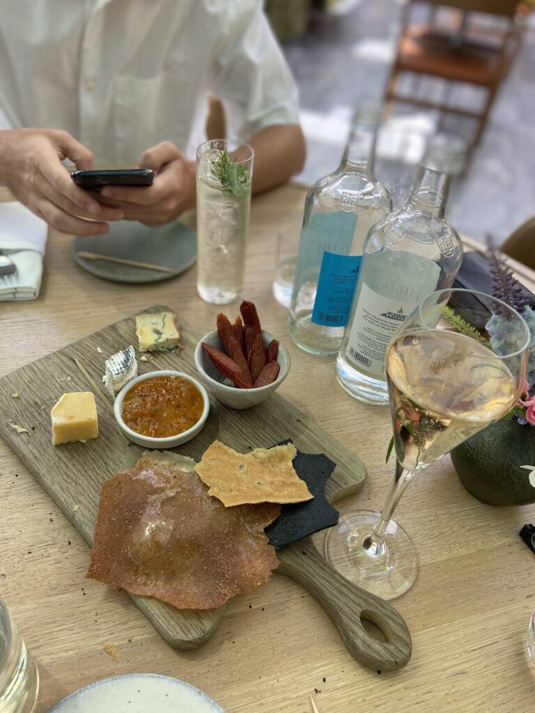 a photo of a charcuterie board with some beverages